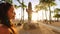 Waikiki Beach Tourist in Honolulu on Oahu, Hawaii in front of famous tourist attraction and surfing landmark, the statue