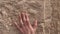 Wailing Wall or Western Wall in Jerusalem. Hand touching stones.