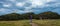 Waipapa Point, New Zealand, October 4, 2019: Beautiful panoramic view of a european men walking on direction to trees curiously