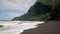 Waipio bay black sand beach and Pacific ocean waves Big Island Hawaii