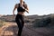 Waist shot of a female runner in the desert