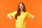 Waist-up portrait cheerful redhead female student in yellow sweater, inviting check-out event, recommend proudct