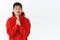 Waist-up portrait of clingy cute asian man in red hoodie, asking for promise, begging help with silly smile, praying
