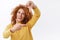 Waist-up portrait, creative good-looking redhead curly woman in yellow sweater, photographer or designer search perfect