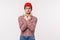 Waist-up portrait funny indecisive guy in glasses and red beanie dont know what choose, pointing sideways at left and