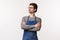 Waist-up portrait of serious-looking determined male restaurant manager looking at employees, control work, cross hands