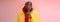 Waist-up serious-looking african-american bearded man in yellow jacket red hoodie bend camera asking keep quiet say shhh