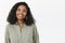 Waist-up shot of cute friendly-looking pleasant African American female friend with curly hairstyle in trendy blouse