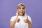 Waist-up shot of optimistic and supportive good-looking caucasian female in white t-shirt cheering and smiling broadly