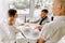 Waiter brought cup of coffee for beautiful couple in a cafe