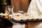 Waiter carrying plates with appetizers