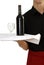 Waiter carrying wine