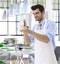 Waiter cleaning wineglass at restaurant