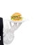 Waiter hand in white gloves holding hamburger on plate