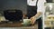 Waiter hands serving cup of coffee, tea and hot drink in a local cafe, small restaurant or bar. Closeup of man and
