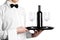 Waiter hands with wine bottle