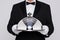 Waiter holding a silver cloche