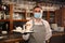 Waiter holding tray with beverages in restaurant. Catering during coronavirus quarantine