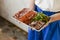 Waiter holds a plate of antipasto and catering platter with different appetizers in a restaurant.I talian cuisine.