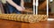 The waiter lays out the kitchen utensils behind dining table before meals