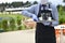 Waiter in a medical protective mask serves  the coffee in restaurant