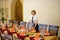 Waiter near the table with food