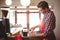 Waiter preparing coffee