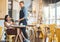 Waiter, retail and coffee shop customer tapping phone on machine for secure and easy mobile payment at cafe store