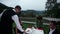 waiter served dinner to lovely couple who celebrate on terrace of luxury