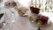 The waiter serves dishes on the festive table. Beautiful dishes on the banquet table, background