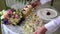 Waiter serves a wedding table.