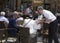 Waiter serving beverages at touristic terrace bar