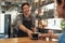 Waiter serving coffee to customer