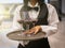 Waiter serving glass of red wine