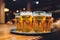 Waiter serving glasses of cold beer on the tray.