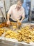 Waiter serving Pescito Frito in a tipycal spanish Freiduria . Cadiz, Spain