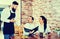 Waiter serving rural restaurant guests at table