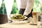 Waiter serving salad in restaurant. Catering during coronavirus quarantine