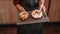 Waiter serving sweet pastry in cafe