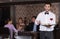 Waiter with serving tray meeting guests