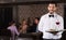 waiter with serving tray meeting guests