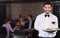 waiter with serving tray meeting guests