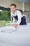 Waiter setting table in bar