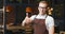 Waiter shows thumbs up, positive owner of restaurant. Portrait of cafe worker