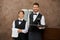 Waiter and sommelier serving wine