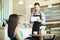 Waiter taking order with a tablet