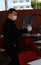 A waiter wearing protective mask serve customers in the pool of a hotel in El arenal beach in Mallorca vertical