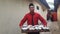 A waiter at a wedding reception is carrying the opening menu