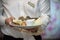 Waiters carrying plates with meat dish at a wedding