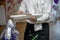 Waiters carrying plates with meat dish at a wedding